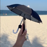 זוג מטריות לכיסוי הטלפון בשמש PhoneBrella