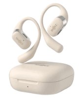 אוזניות אלחוטיות צבע בז' Shokz OpenFit Open-Ear – Bluetooth זוג אוזניות אלחוטיות בצבע בז מרחפות מעל מארז טעינה תואם