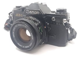 Canon AE-1 film camera+ canon FD lens 50 1.8  1104527 מצלמת פילם