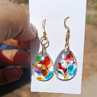 Handcrafted clear resin teardrop earrings filled with colorful crushed glass shards on gold hooks.