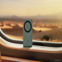 נתב נייד Zte U30 Air Mifi 5G – פריט בודד ירוק כהה מונח ליד חלון על רקע מדבר