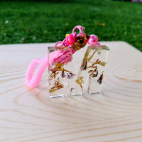 Handcrafted English letter M keychain with a glossy, colorful personalized design.