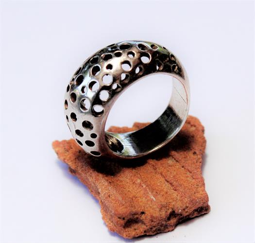 Handmade silver ring decorated with delicate cutouts around