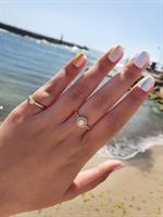 טבעת יהלומים - טבעת זהב משובצת יהלומים בסגנון היילו