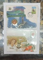 זוג מעטפות בולים ומטבעות מהעולם: אוגנדה, שנת 1990+ בליז, שנת 1980