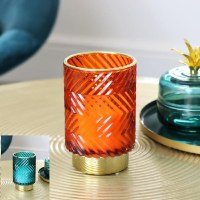 נר ריחני בפמוט זכוכית עם עיטורי זהב  Cut Glass – ענבר / כחול ירקרק