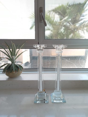 A pair of crystal candlesticks with stones