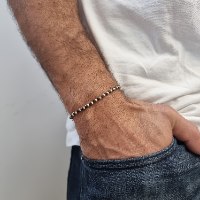 צמיד חרוזים כדורי אוניקס וכדורי זהב