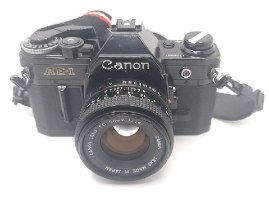Canon AE-1 film camera+ canon FD lens 50 1.8  1104527 מצלמת פילם