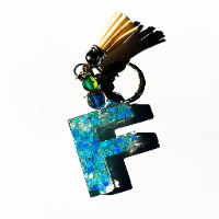 Handcrafted English letter keychain from A to Z, featuring a glossy finish with colorful glitter and unique patterns.